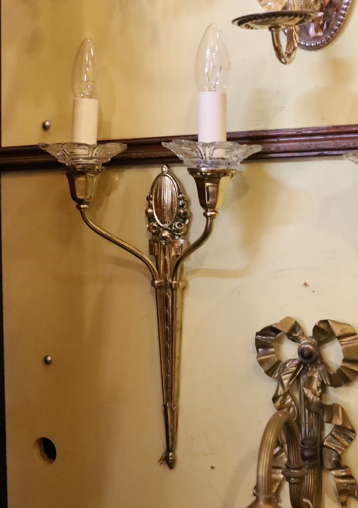 A pair of 1930s French silver brass and glass twin branch wall lights, height 41cm to top of bulb holders, width 26cm